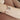 The woman has a rose gold bracelet on her wrist.