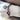 The woman has a black bracelet on her wrist.