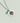 On a white background, there is a necklace with a single stone.