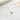 Aquamerine birthstone necklace with a halo setting displayed on soft white fabric – shimmering and vibrant pendant centerpiece.
